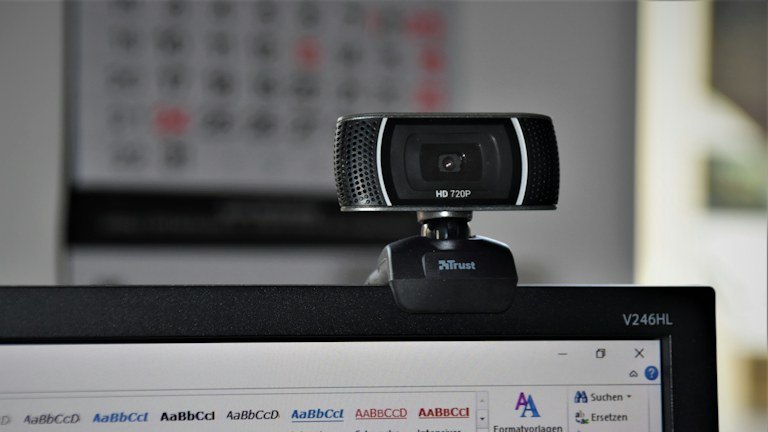 Webcam mounted above a computer screen