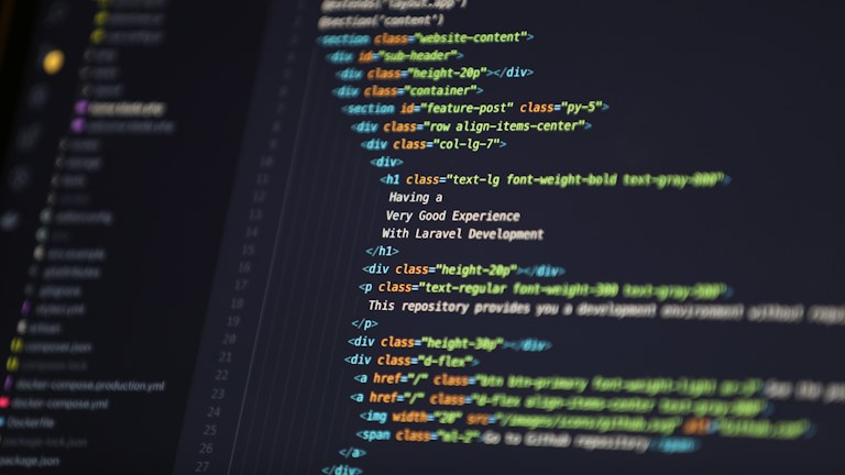 Computer screen displaying HTML code for a web development project