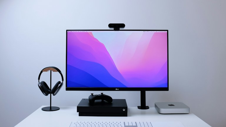 a computer monitor sitting on top of a desk
